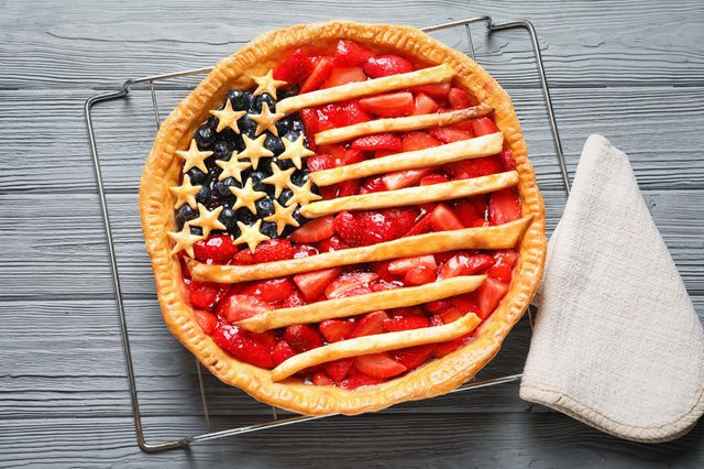 Tasty American flag pie on wooden table