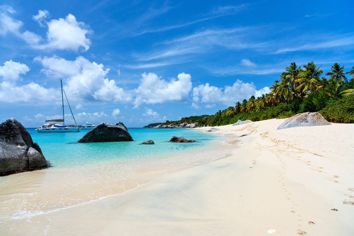 Stunning beach with white sand, unique huge granite boulders, turquoise ocean water and blue sky at Virgin Gorda, British Virgin Islands in Caribbean