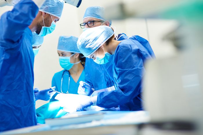 Close up of surgery team operating 