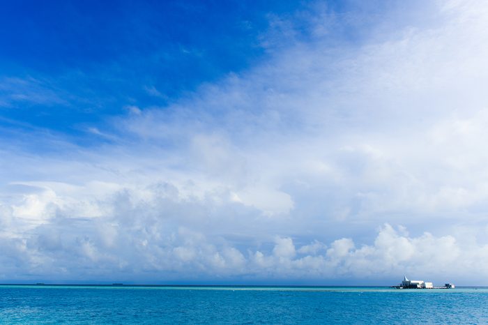 House in the sea with clear blue sky