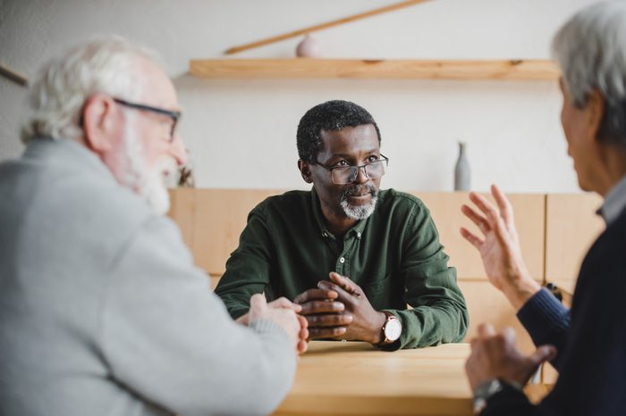 group of senior friends spending time together and sharing stories from past