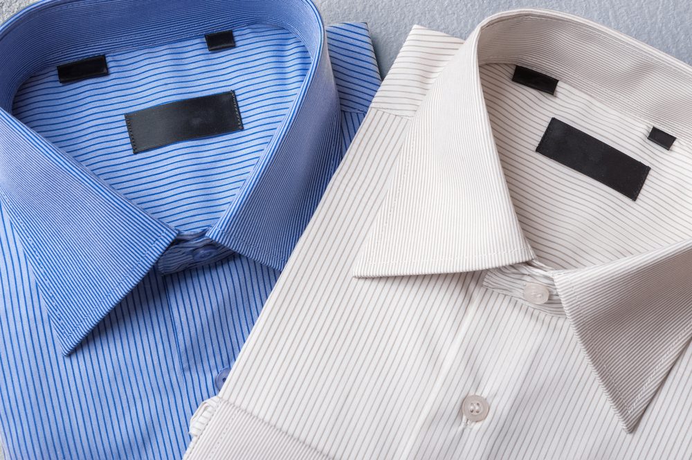 Studio shot of couple of man's shirts on a grey background