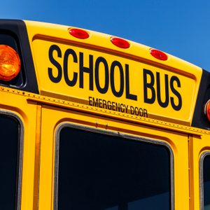 Yellow School Bus in a District Lot Waiting to Depart for Students VI