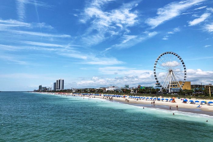 Ferris Wheel In City Against Cloudy Sky On Myrtle Beach