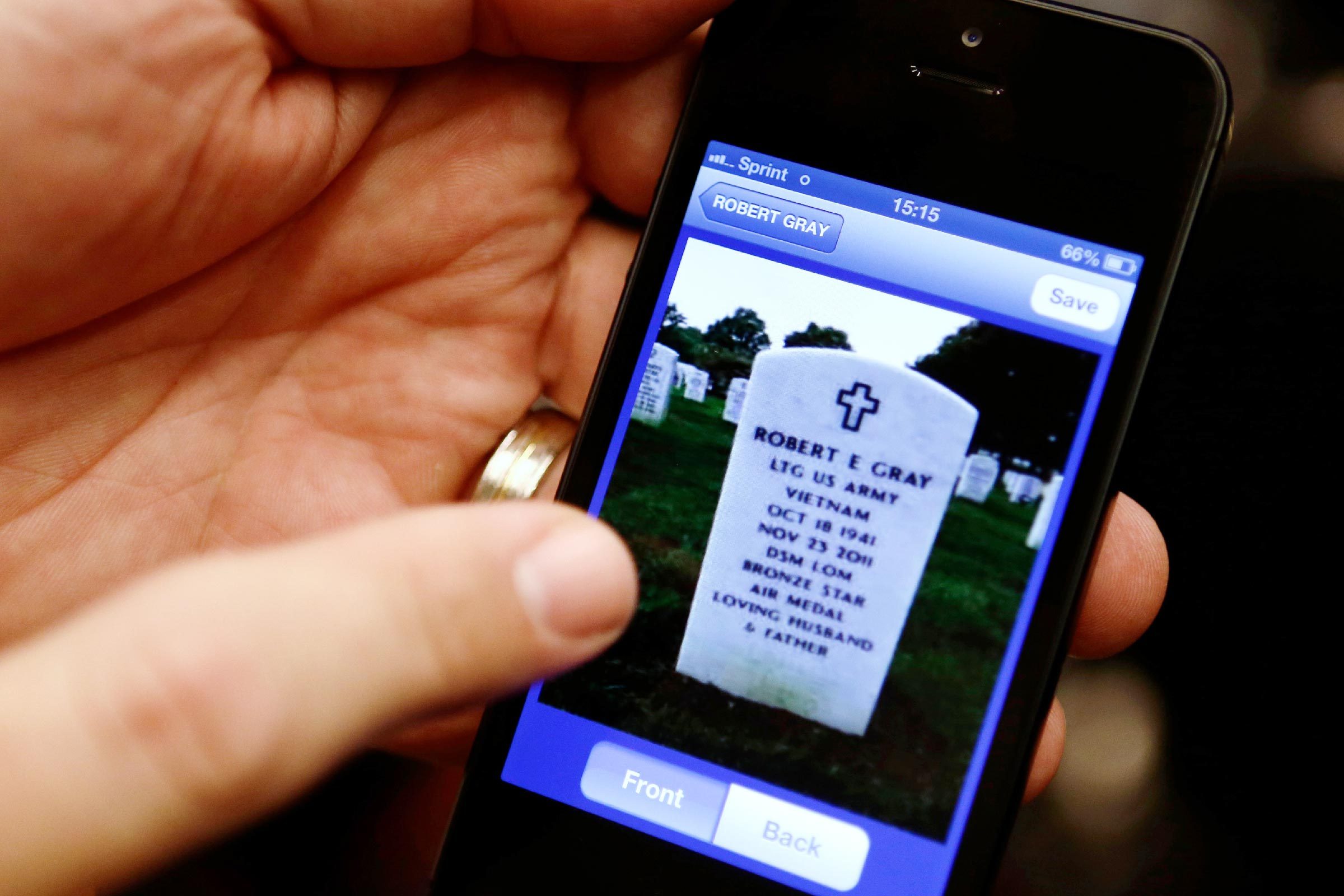 John Schrader Army Col. John Schrader demonstrates the ANC Explorer application for Arlington National Cemetery, on his phone, after a news conference in Washington, . Arlington National Cemetery plans to make available to the public the detailed geospatial database it has developed over several years while overhauling its records and responding to reports of misidentified remains. The database will be available over the Internet and through a mobile phone app that visitors to the cemetery can take with them to find a specific gave anywhere in the cemetery