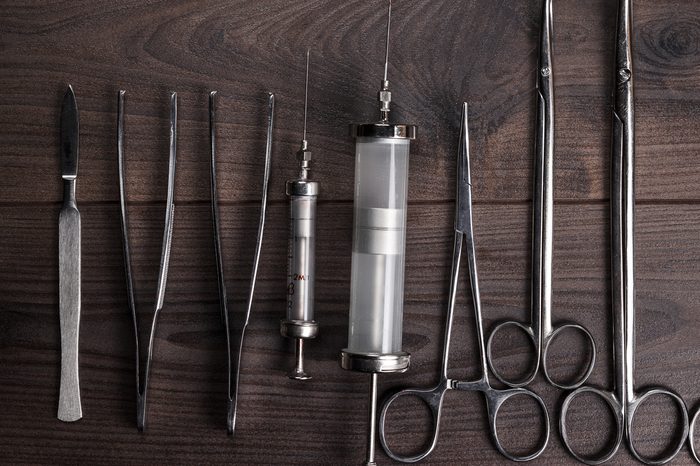 surgical armaments on the brown wooden table