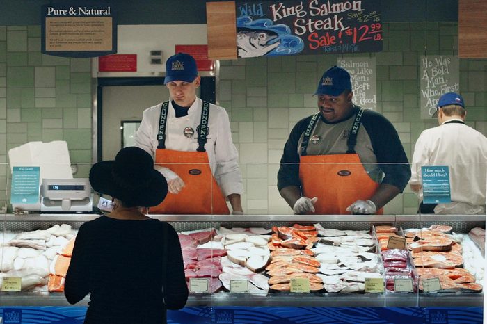 A customer makes her selections at the seafood section of the new Whole Foods market, in Austin, Texas. The store's opening this spring coincided with the chain's 25th anniversary and symbolizes how far the natural and organic grocer has come. Since CEO John Mackey founded the chain in 1980, Whole Foods has grown to 169 stores and dozens more are in development