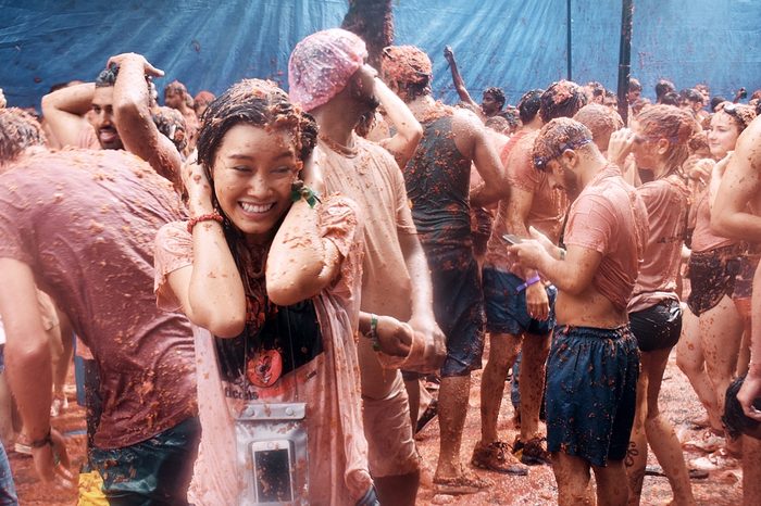 BUNOL, SPAIN - AUGUST 30 - A woman in a battle of Tomatoes in La Tomatina Festival, Bunol, Spain in August 30 , 2017