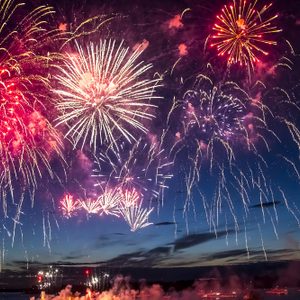 colorful fireworks on the black sky background over-water