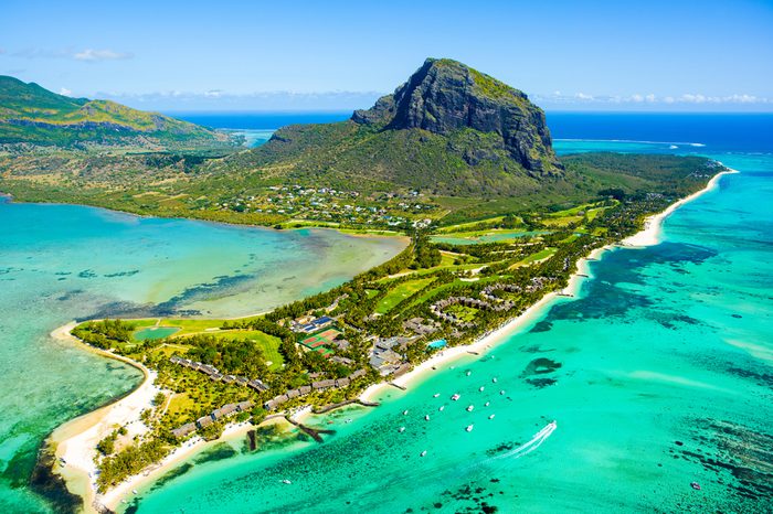 Aerial view of Mauritius island panorama and famous Le Morne Brabant mountain, beautiful blue lagoon and underwater waterfall