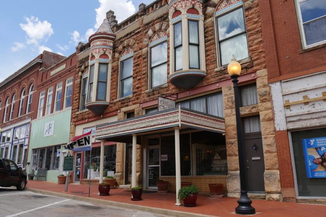 GUTHRIE, OKLAHOMA—APRIL 2017: Façade of Aunt Gertrude’s House, a gallery in Guthrie, Oklahoma that sells crafts, gifts, art jewelry, fine art, pottery and more and repairs and restores antique dolls.