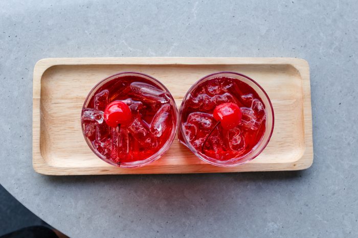 Welcome drink, red fruit mixed with soda and ice to quench thirst on hot days on the table.