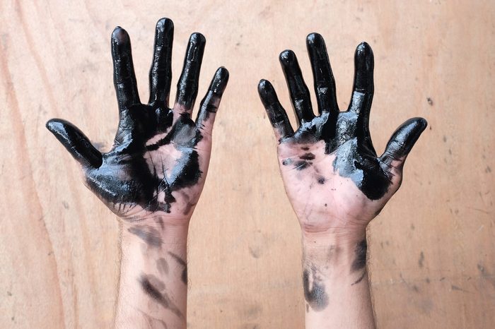 hands of car oil change