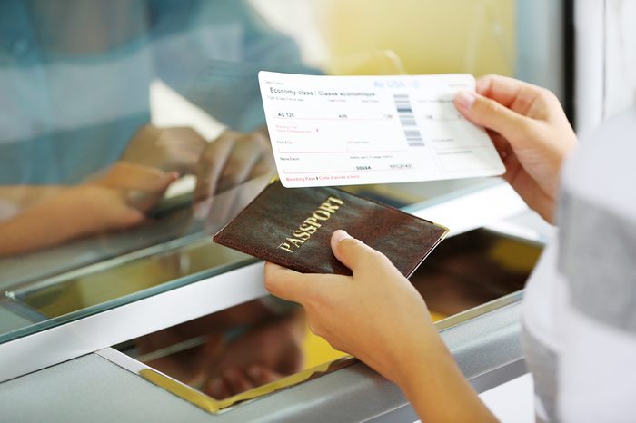 Airport Check-In Counters With Passengers 