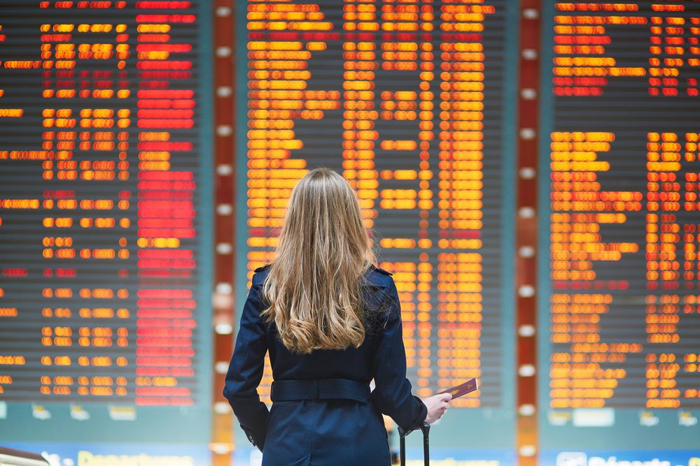 Woman looking at airline flight times