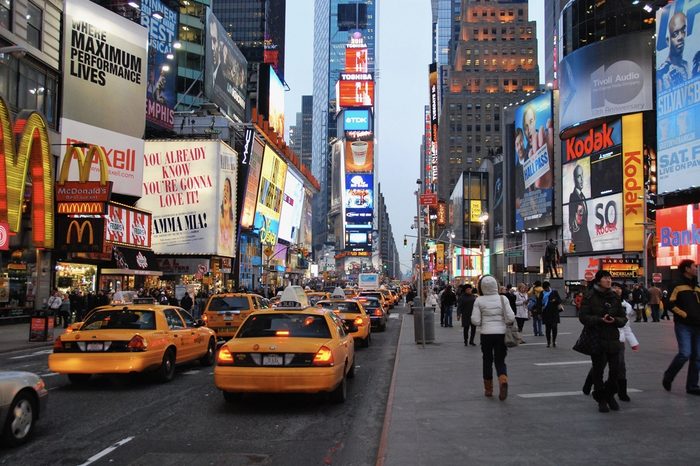 New York, USA - 7 February 2011, view of Times Square late afternoon in winter with taxis and people walking