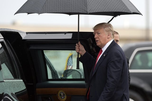 President Donald Trump gets into his car after arriving at Eastern Iowa Airport, in Cedar Rapids, Iowa