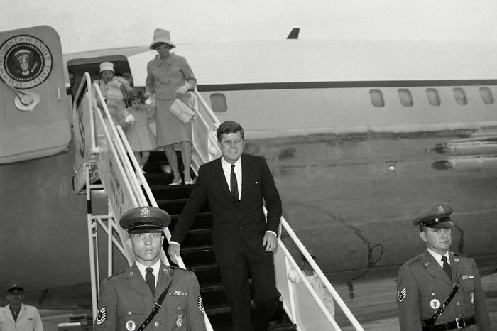 John Kennedy, JFK, Jacqueline Kennedy President John F. Kennedy leaves his plane at Otis Air Force Base, Mass.,, for a long weekend holiday at his nearby Hyannis Port home. Mrs. Jacqueline Kennedy walks down the ramp hand-in-hand with daughter Caroline. Nurse Maud Shaw carries John Jr., in the background