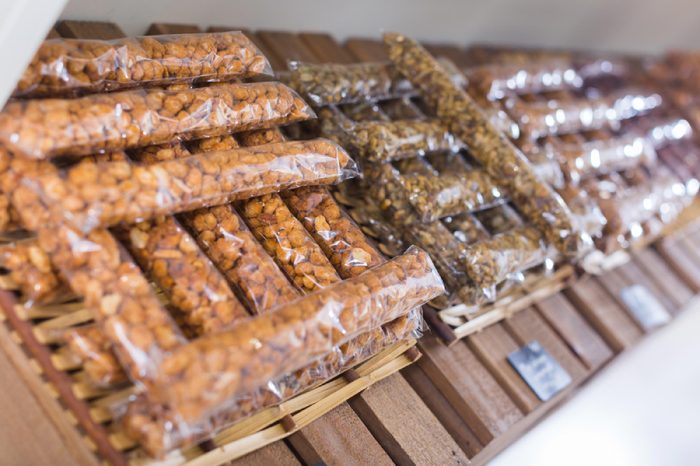 Image of showcase with dried fruits and nuts in container in the store.