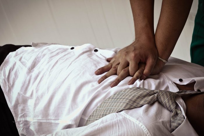 Close up of doing CPR for victim who has accident. First aid process to safe life.