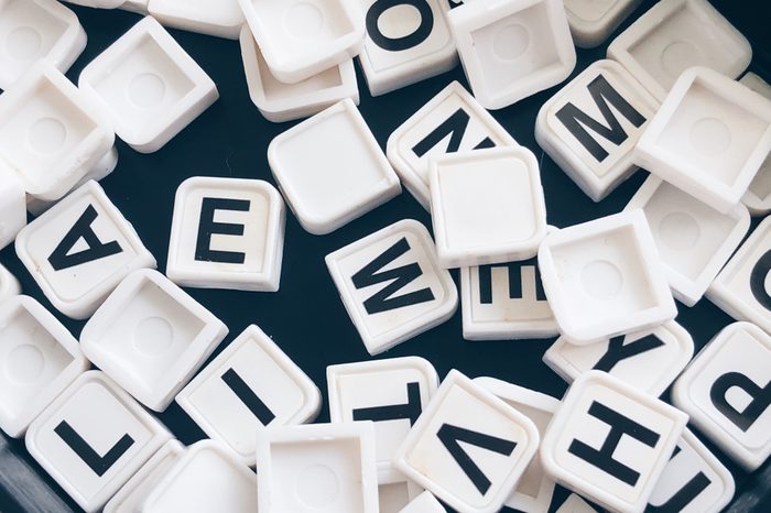 Assorted letter tiles jumbled up in a pile