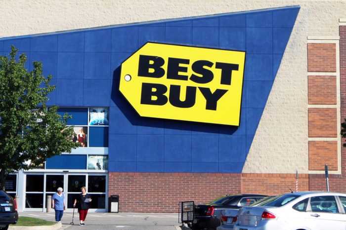 TAYLOR, MI-OCTOBER, 2015: Customers leaving a Best Buy store in this Detroit suburb. Note the glass roof which allows natural light into the store.