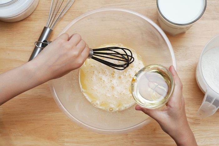 Cooking with Kids. Girl Hand Mixing Ingredient Cook Muffin Dough Wooden Table