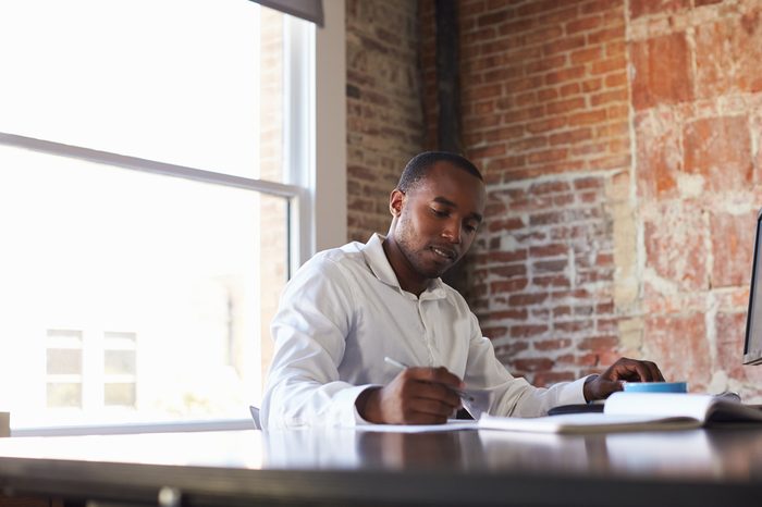 Businessman Working On Computer In Office