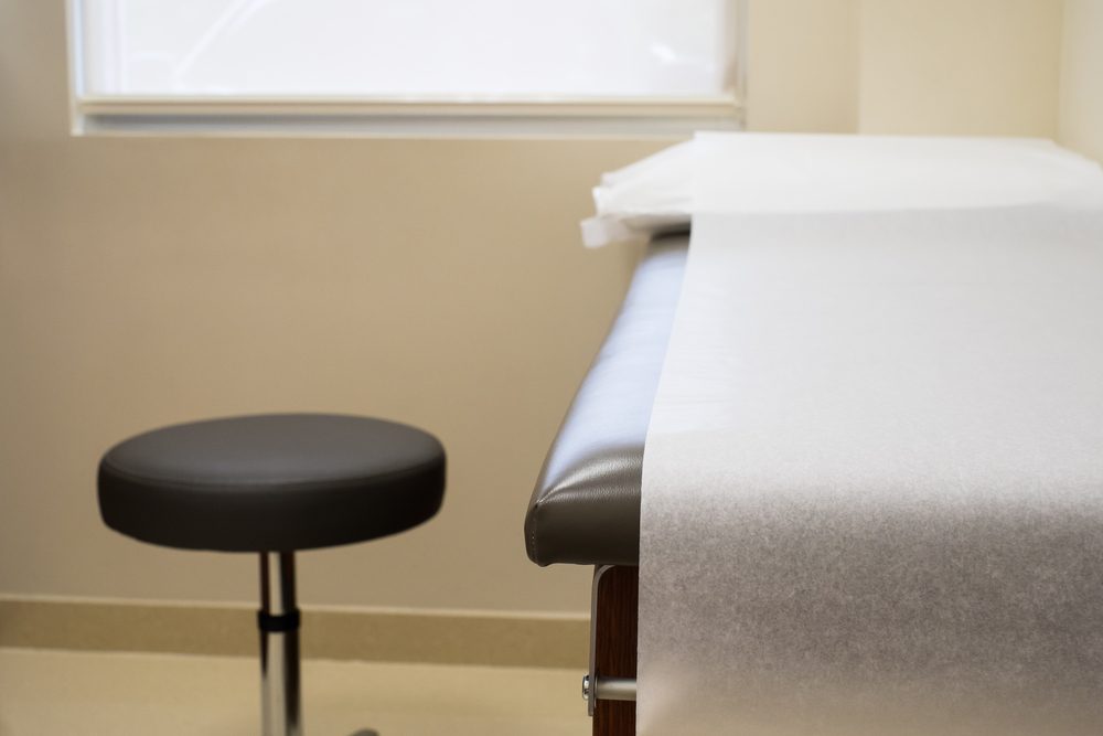 Patient examination table in a doctors office.