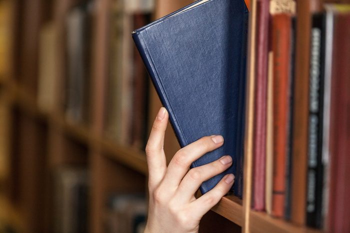 Hand holds book.