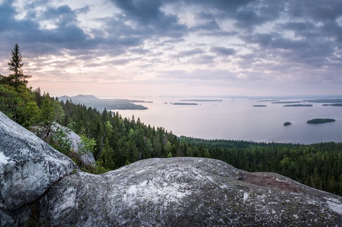 Scenic landscape with lake and sunset at evening in Koli, national park, Finland