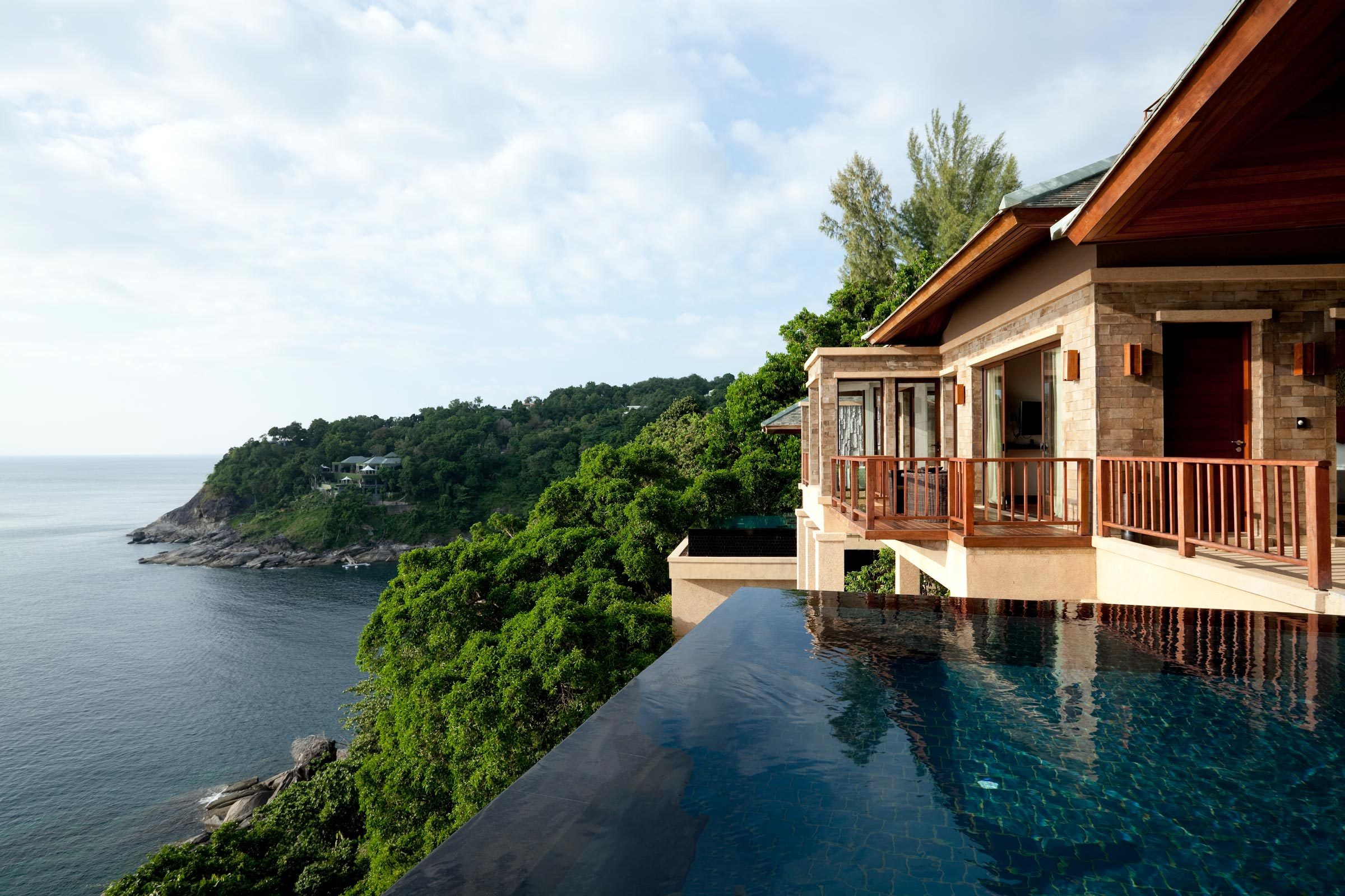 luxury vacation house with an infinity pool looking over a lake