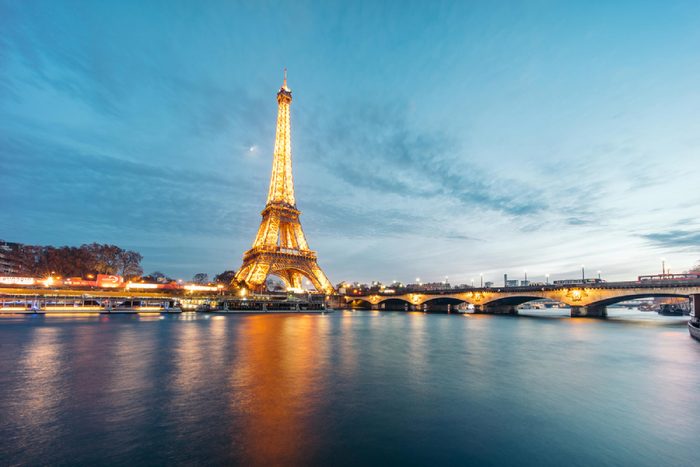 PARIS, FRANCE - DECEMBER 7, 2016: Eiffel Tower (Tour Eiffel) illuminated at night. It's a wrought iron lattice tower named after the engineer Gustave Eiffel