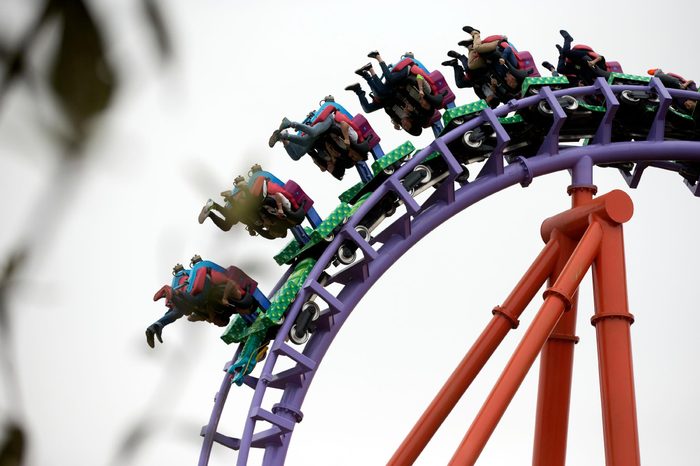 People go upside down as they ride a roller coaster at the Nanchang Wanda Park theme park at the Wanda Cultural Tourism City in Nanchang in southeastern China's Jiangxi province, . China's largest private property developer, the Wanda Group, opened an entertainment complex on Saturday that it's positioning as a distinctly homegrown rival to Disney and its $5.5 billion Shanghai theme park opening next month