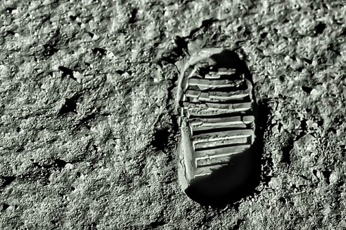 Buzz Aldrin's footprint on the moon. Astronaut's boot print on lunar moon landing mission. Moon Surface. Image of the Moon showing landing site of Apollo 11. Elements of this image furnished by NASA