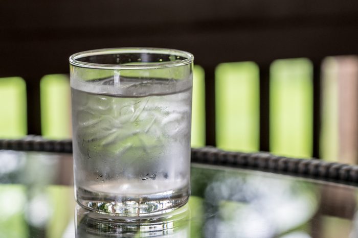 Glass of water on glass table