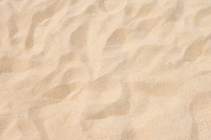 Fine beach sand in the summer sun