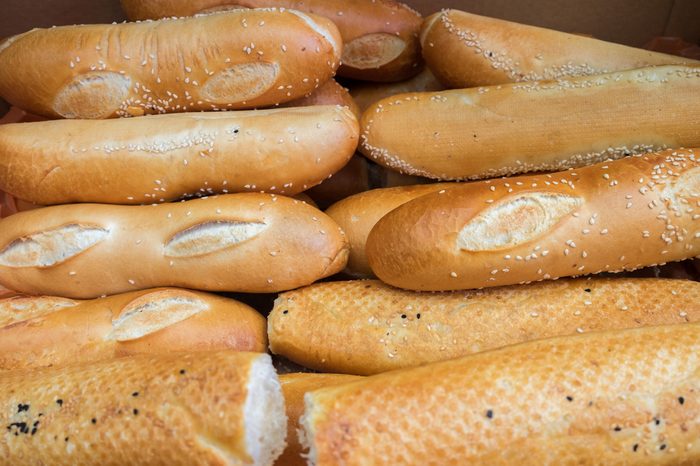 Fresh sesame bread rolls in a box at the city market