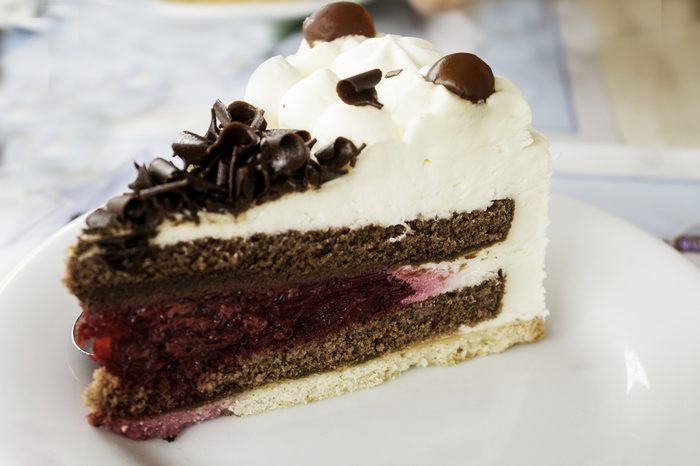 Chocolate and raspberry cake with cranberries, dessert in restaurant