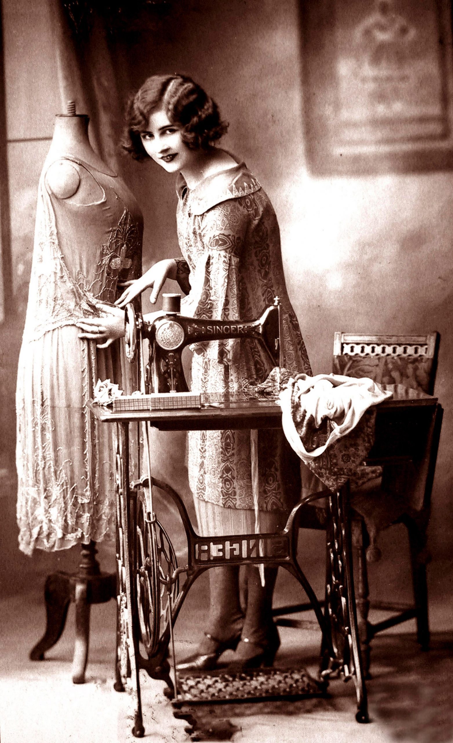 Fashion designer with sewing machine