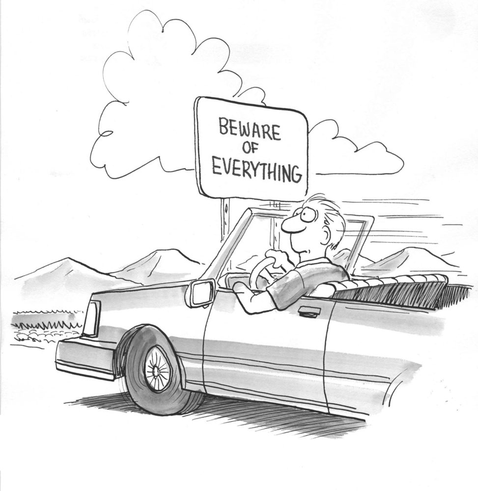 worried driver looking at sign