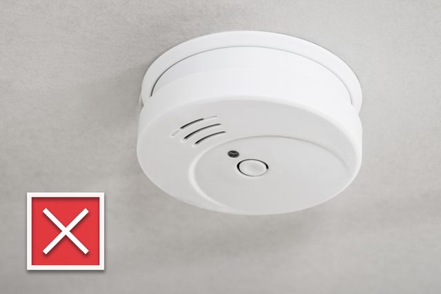 Close-up Of White Smoke Detector On A Ceiling