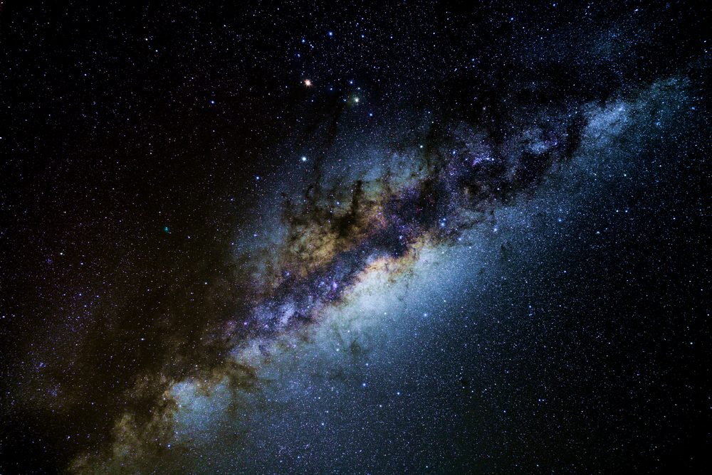 The core of our Milky Way galaxy in the dark skies of Atacama Desert. Planets Mars and Saturn form a bright triangle with Antares, the scorpion's heart. Comet 252P/LINEAR is left of and below Saturn.