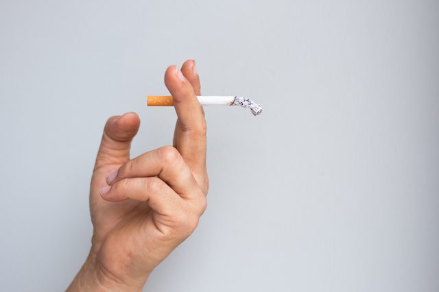 man smoking a cigarette