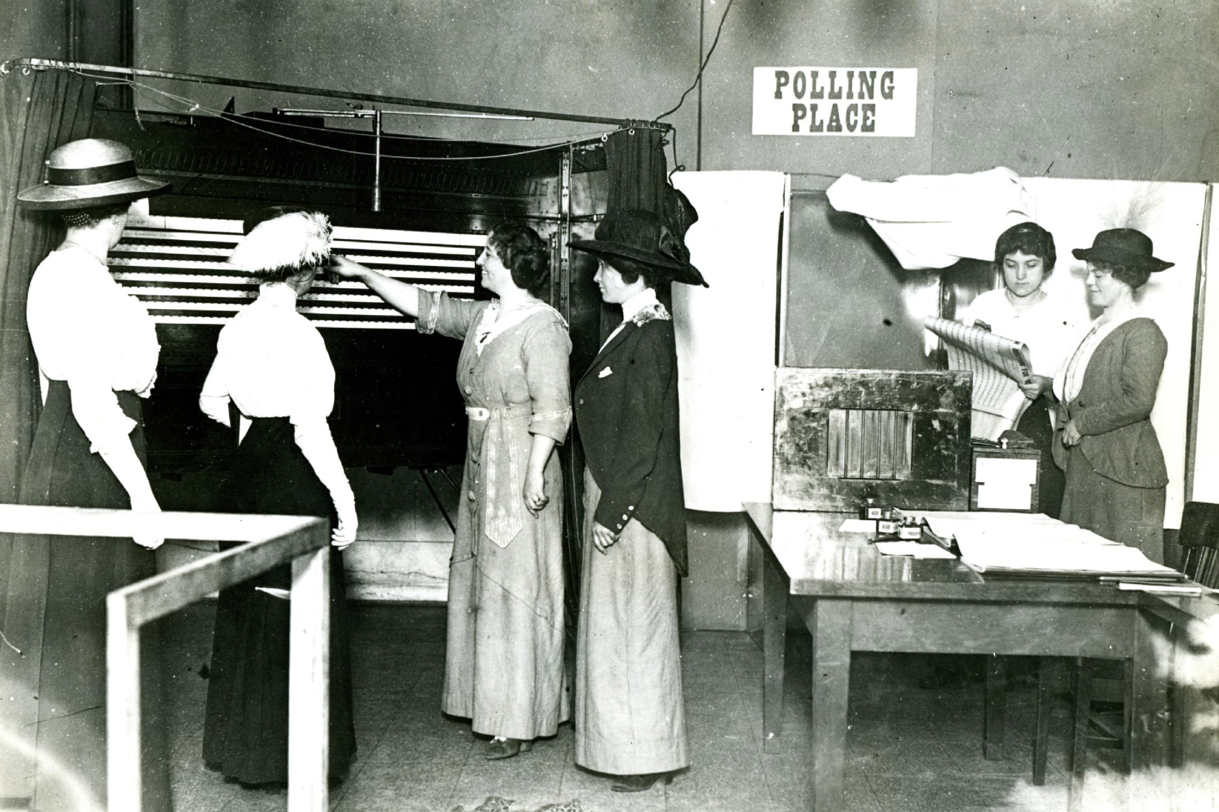 Chicago, Around 1915 -- The Earliest Beginnings Of Women's Participation In Government. Five Women Learning How To Use A Voting Machine In Chicago