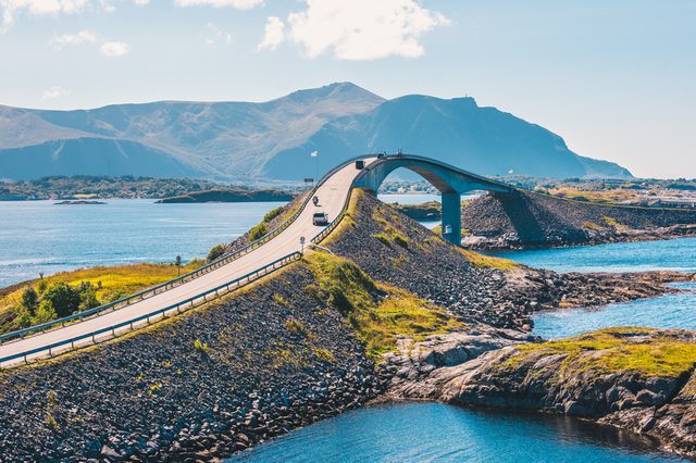 World famous Atlantic road bridge (Atlanterhavsvegen) with an amazing view over the norwegian mountains. Atlantic road runs through an archipelago in Eide and Averøy in Møre og Romsdal, Norway.