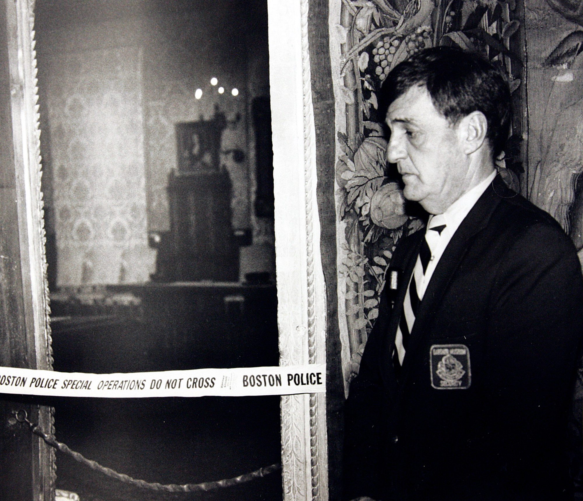 A security guard stands outside the Dutch Room of the Isabella Stewart Gardner Museum in Boston, where robbers stole more than a dozen works of art by Rembrandt, Vermeer, Degas, Manet and others, in an early morning robbery March 18, 1990. The FBI said, it believes it knows the identities of the thieves who stole the art. Richard DesLauriers, the FBI's special agent in charge in Boston, says the thieves belong to a criminal organization based in New England the mid-Atlantic states Art Heist Mystery, Boston, USA