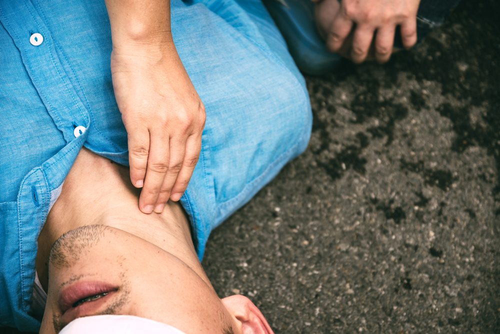 Unconscious, Pulse Checking Carotid Artery on a Man who has Senseless, One Part of the Resuscitation (First Aid)