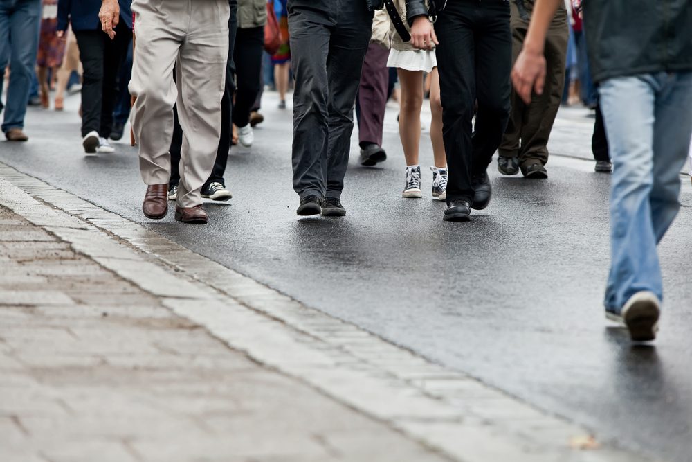 Crowd walking - group of people walking together (motion blur)