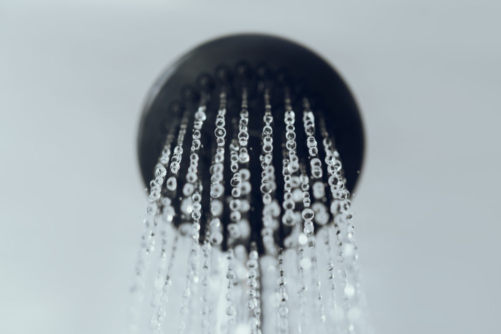 shower head with water drop flowing.